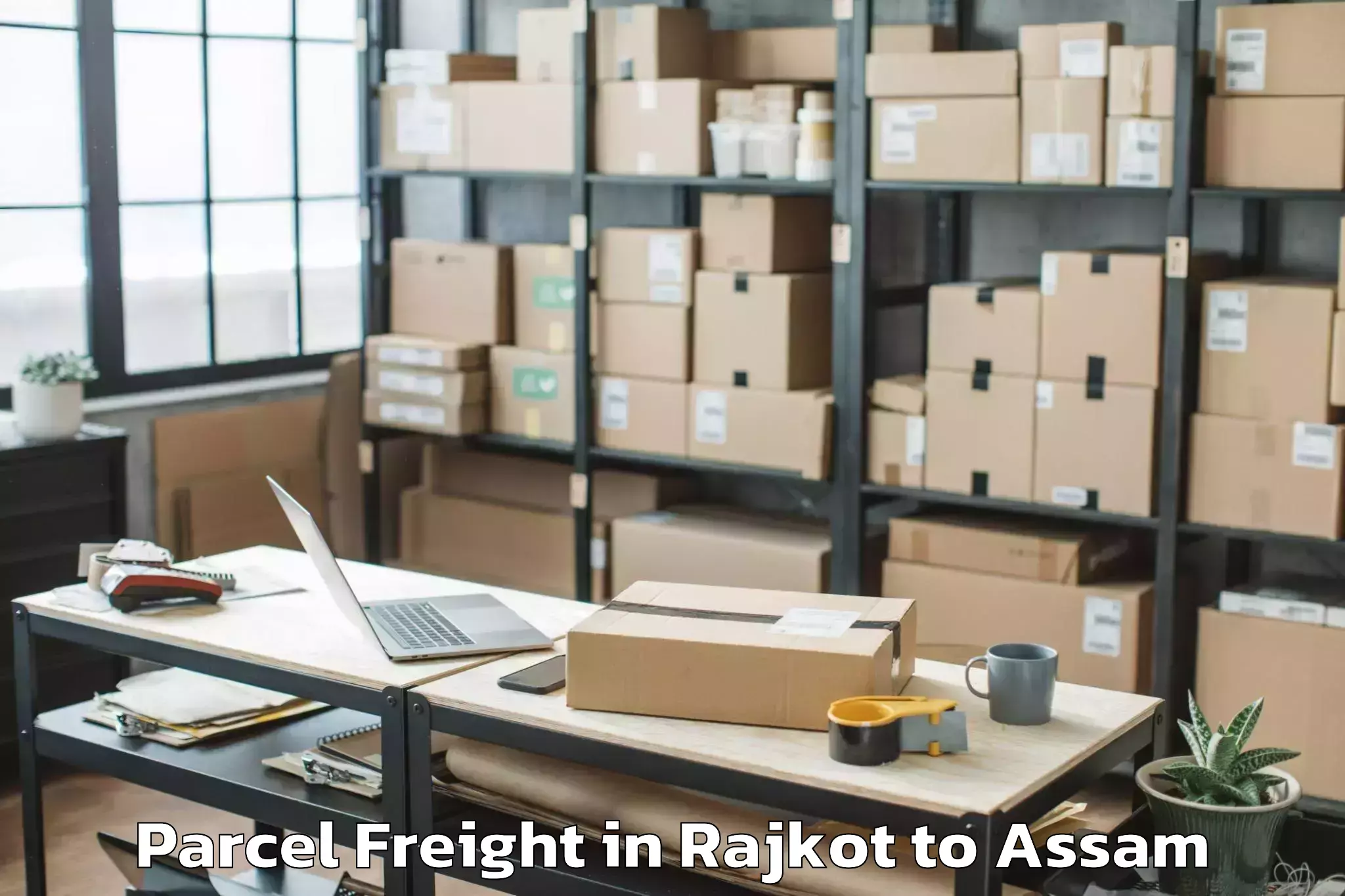 Book Rajkot to Patharighat Parcel Freight